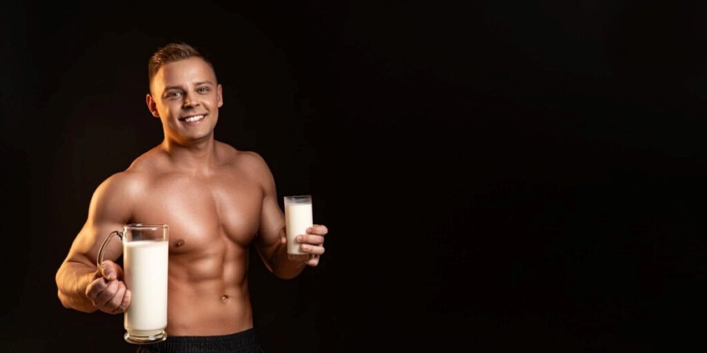 athletic-man-holding-bottle-milk-hand